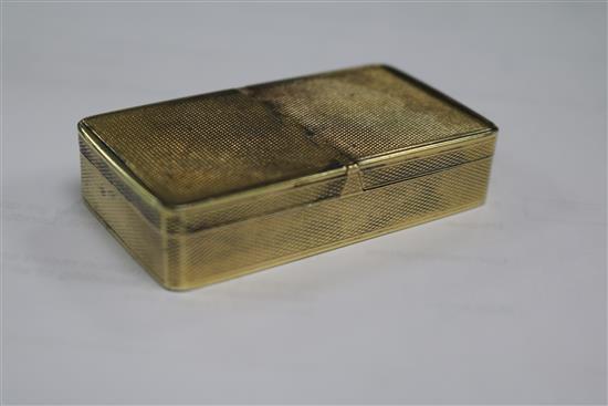 A George IV engine turned silver gilt double lidded snuff box by John Linnit, London, 1822, 71mm.